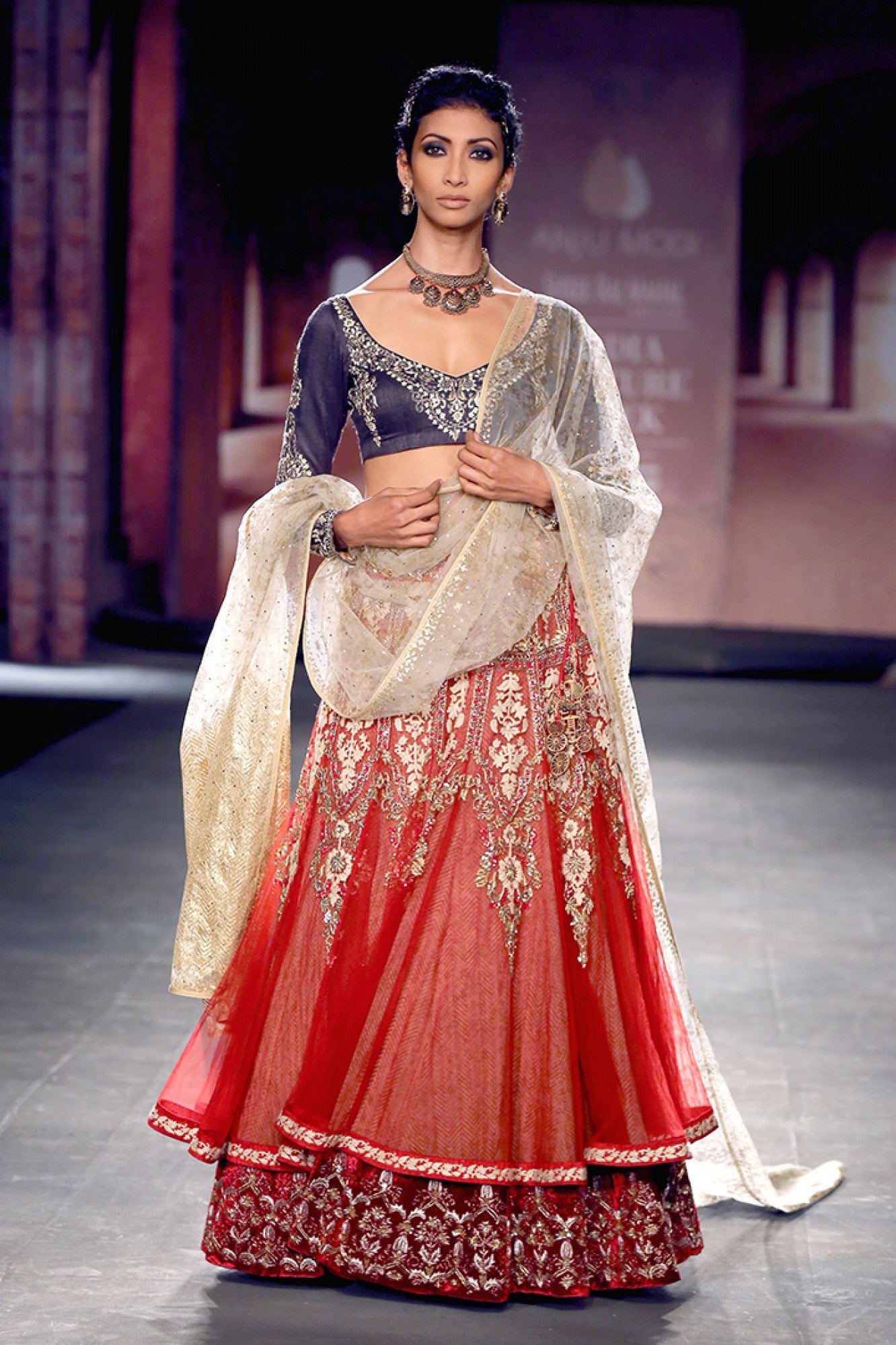 Indigo blouse with red anarkali lehenga