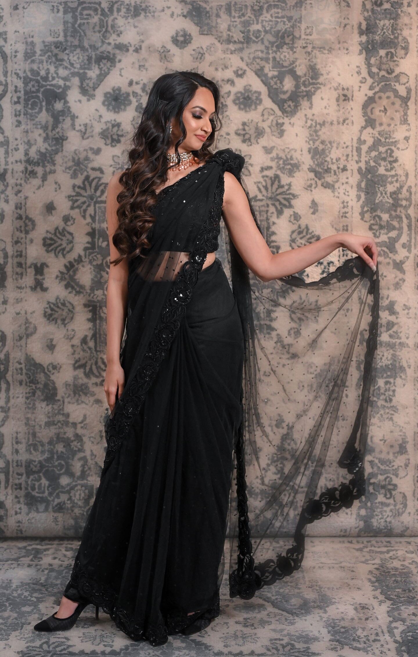 Complete Your Wardrobe With This Black Colored Net Saree