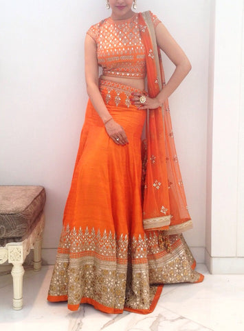 Orange color lehenga choli in Gotta patti work