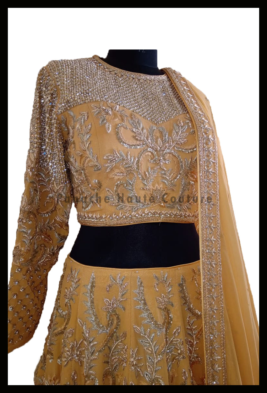 An Elegant Gold Beige Party Wear Lehenga Paired with a Silk Georgette Dupatta From Panache Haute Couture