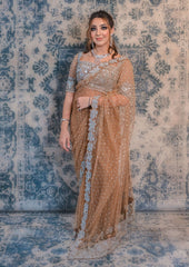 Go for a nonchalant style with this Fawn Brown coloured net saree