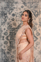 Let your wedding excitement prevails with this designer Peachish pink saree