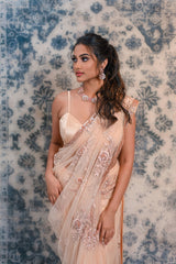 Let your wedding excitement prevails with this designer Peachish pink saree