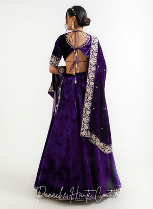 Full-length view of violet silk velvet lehenga skirt and matching embroidered shawl