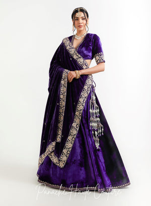 Bride draping the matching violet silk velvet shawl over the shoulder, Niya lehenga set